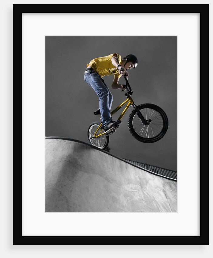 BMX Biker Performing Tricks by Anonymous
