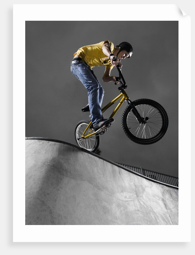 BMX Biker Performing Tricks by Anonymous