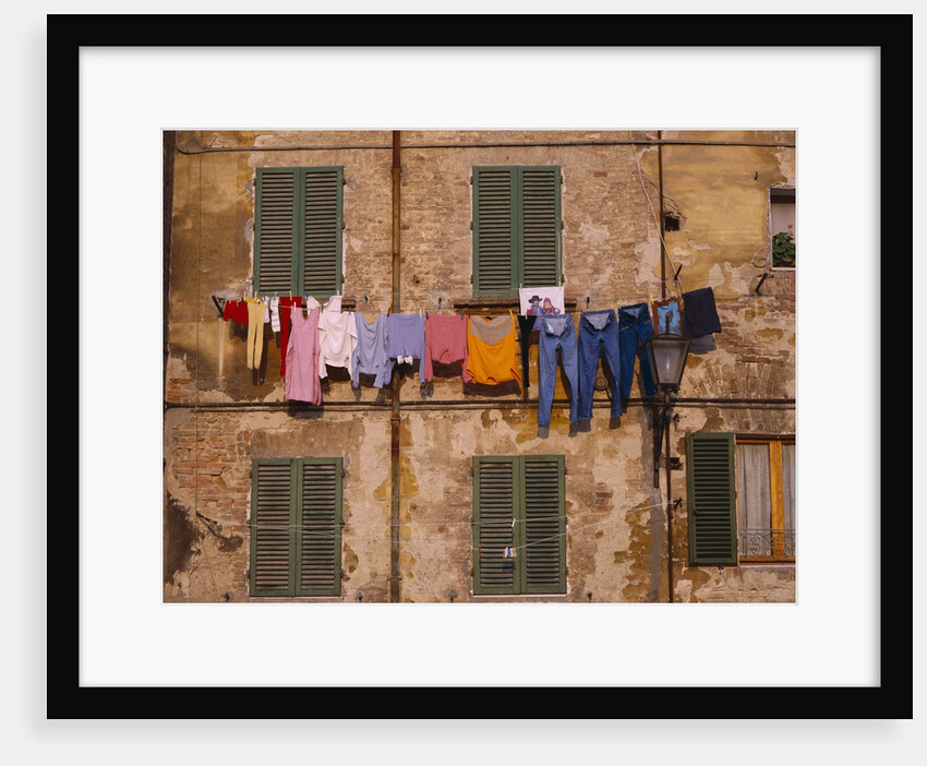 Laundry Hanging Outside Windows by Anonymous