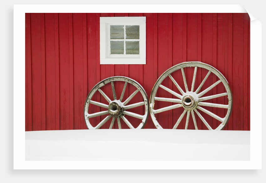 Wagon Wheels on Snow Against Stable by Anonymous