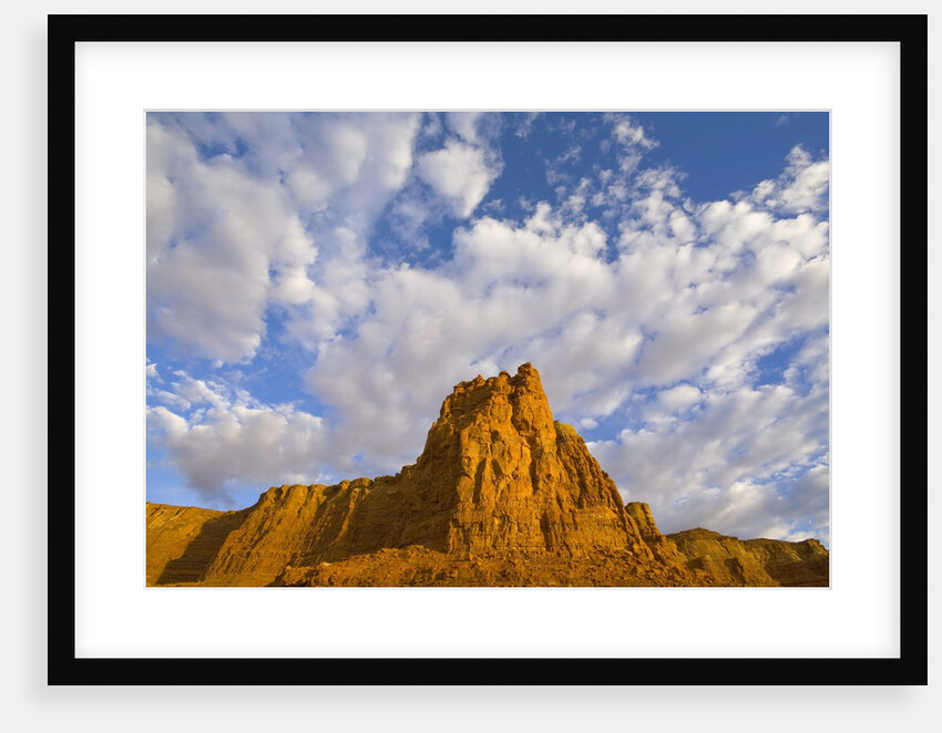Cumulus Clouds Over Sandstone Buttes at Sunrise by Anonymous