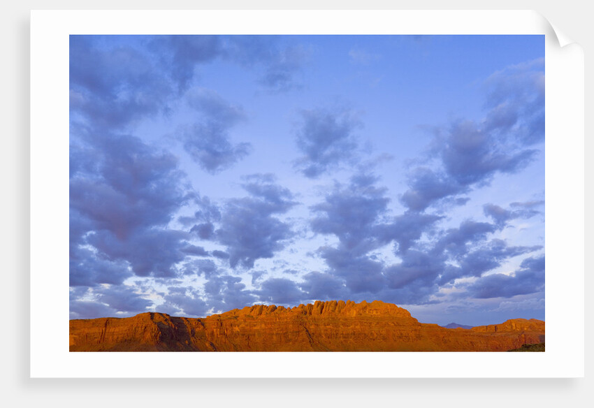 Cumulus Clouds Over Sandstone Buttes at Sunrise by Anonymous