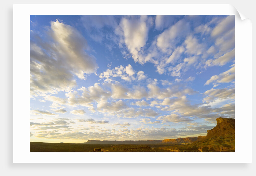 Cumulus Clouds Over Sandstone Buttes at Sunrise by Anonymous