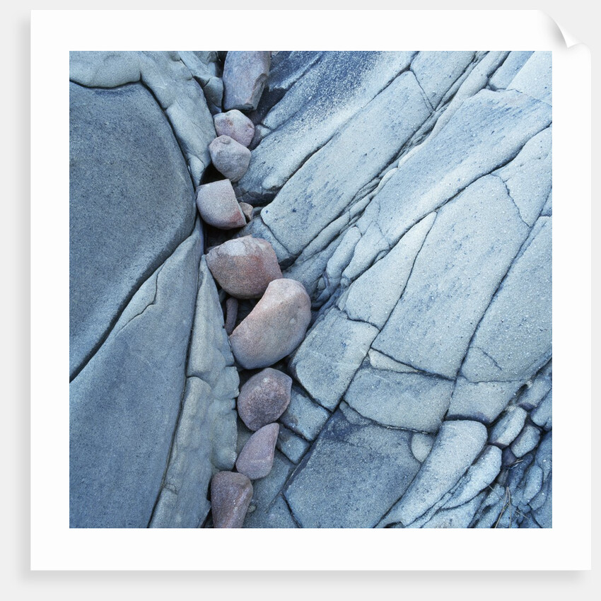 Rocks Against Cracked Boulder by Anonymous