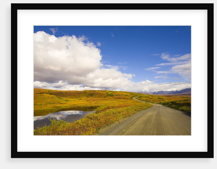 Clouds Above Autumn Tundra and Gravel Road in Alaska by Anonymous