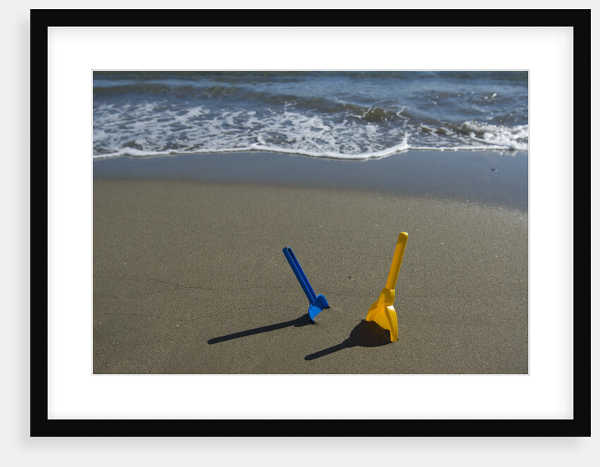 Toy Shovels in Sand by Anonymous