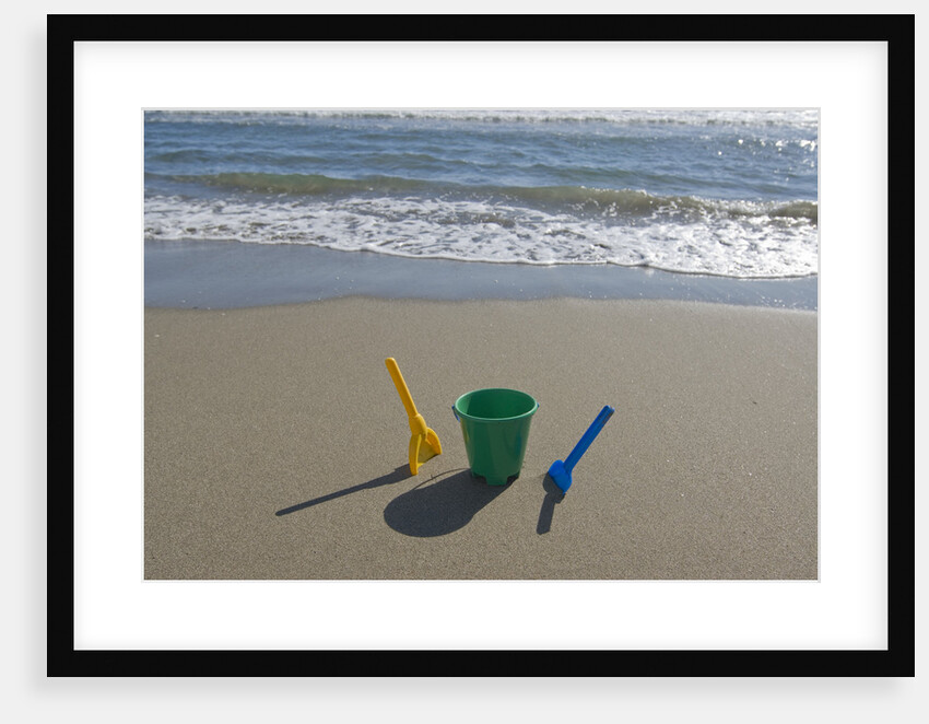 Toy Shovels in Sand by Anonymous