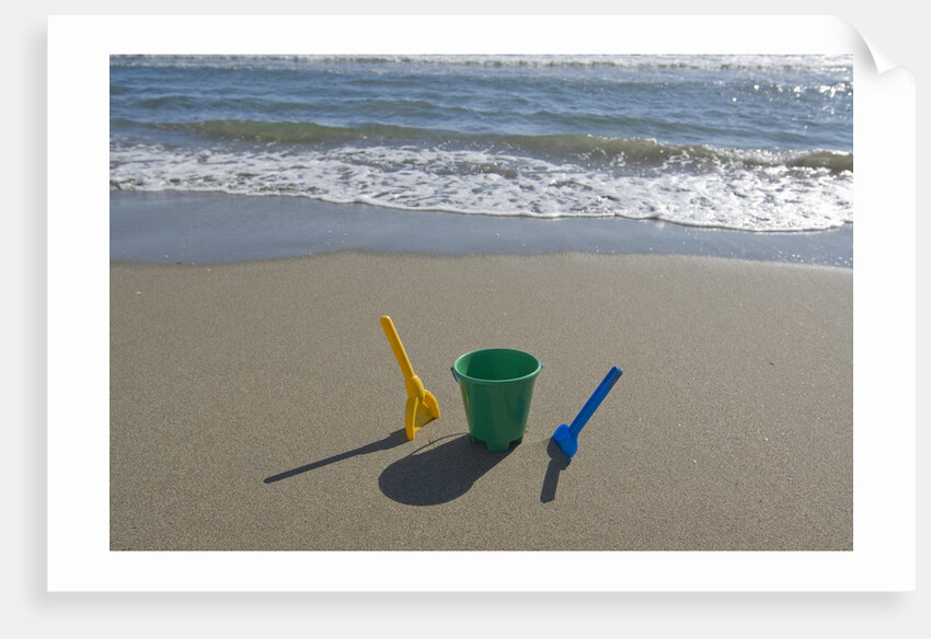 Toy Shovels in Sand by Anonymous