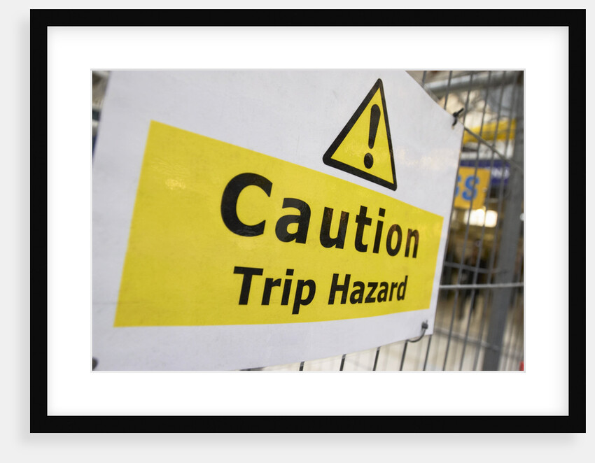 Caution Trip Hazard Sign on Construction Site by Anonymous