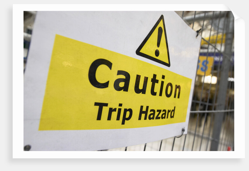 Caution Trip Hazard Sign on Construction Site by Anonymous
