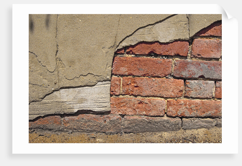 Brick Wall Part Covered By Plaster by Anonymous