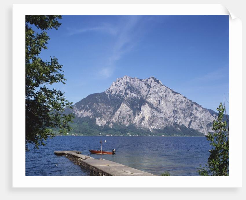 Wooden Boat Tied to Dock on Lake by Anonymous