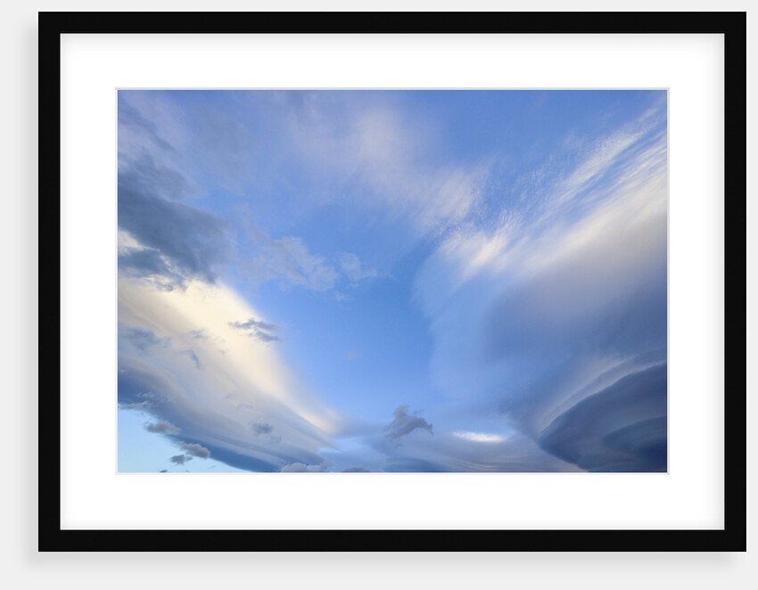 Bright Cumulus and Lenticular Clouds at Sunrise by Anonymous