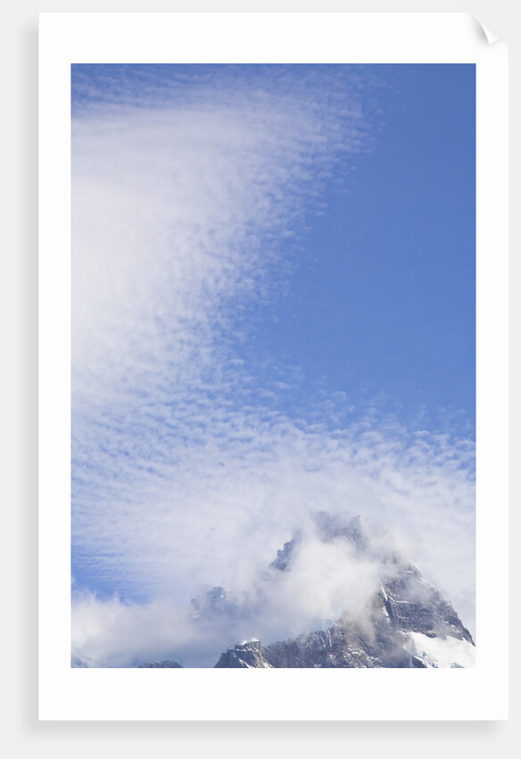 Cirrocumulus Clouds Above Rocky Crags by Anonymous