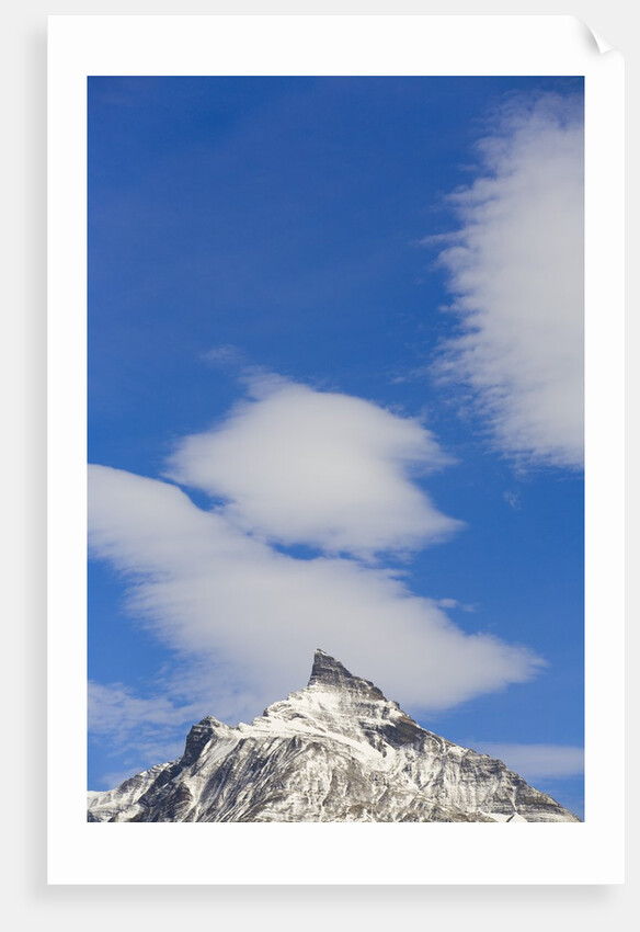 Clouds and Snowy Mountain Peak by Anonymous