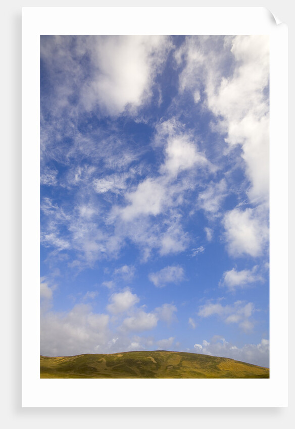 Cumulus Clouds above Hill by Anonymous