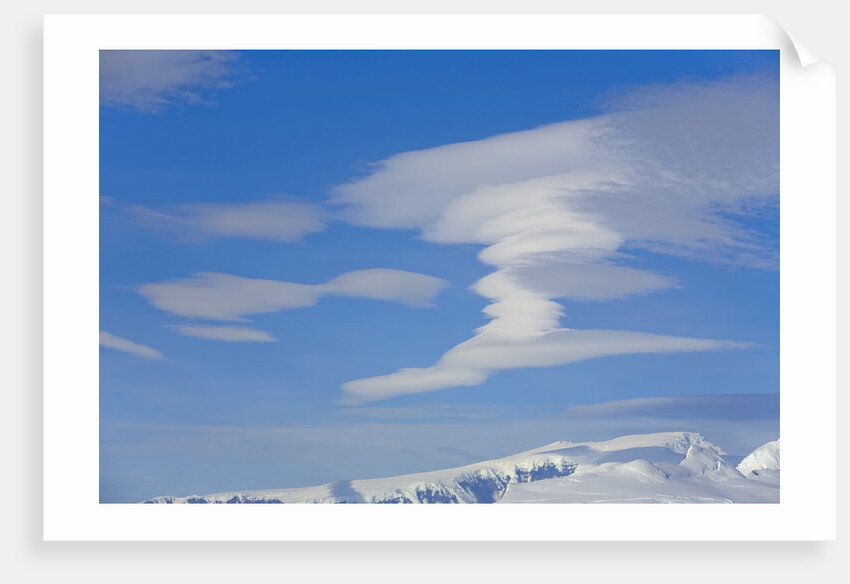 Lenticular Clouds Floating above Snow-covered Glacier by Anonymous