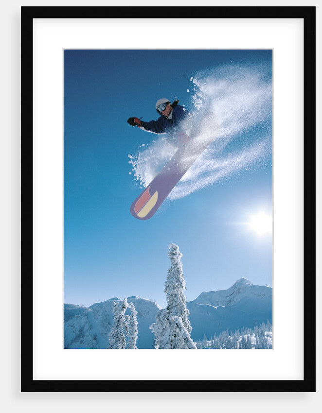 Man snowboarding on sunnny day by Anonymous