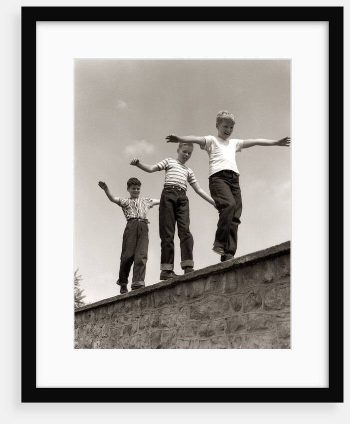 1950s Laughing Boys Walking On Top Of Stone Wall Arms Out Balancing Playing Follow The Leader by Anonymous