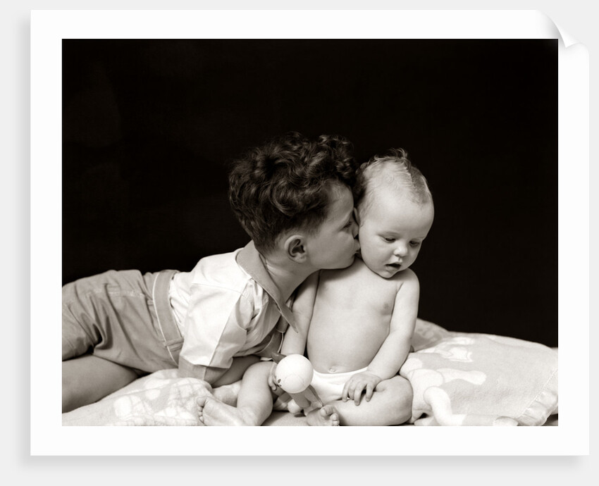 1940s Curly Haired Boy Toddler Leaning And Kissing Cute Baby by Anonymous