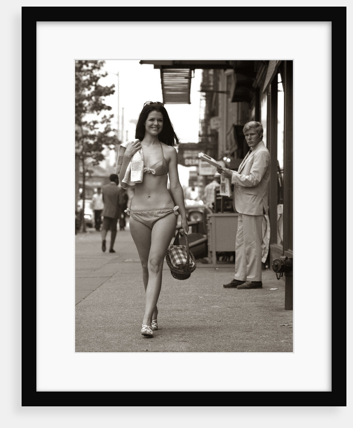 1970s Man Ogling Sexy Young Woman Walking Down City Street Wearing Only A Bikini by Anonymous