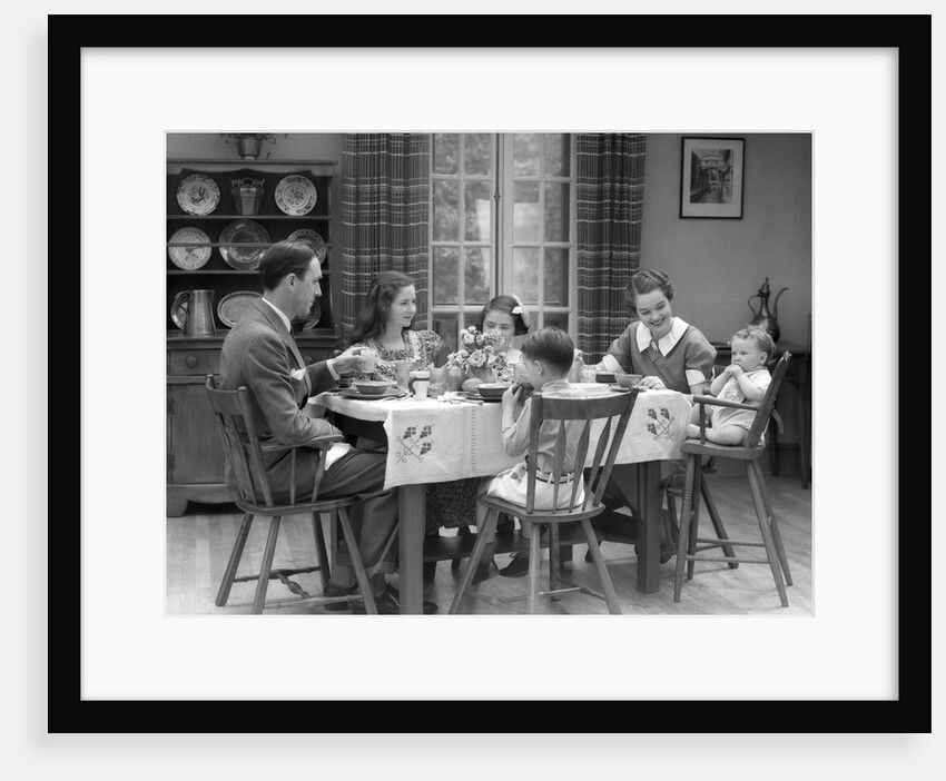 1930s Family Of 6 Sitting At The Table In A Dining Room Eating Breakfast The Baby Is Sitting In A High Chair by Anonymous