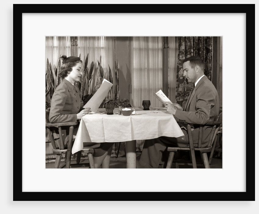 1950s Couple Man Woman Reading Restaurant Menus by Anonymous