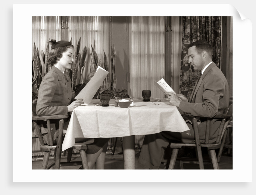 1950s Couple Man Woman Reading Restaurant Menus by Anonymous