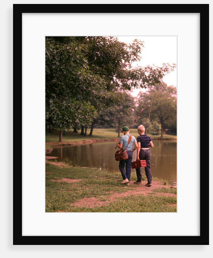 1970s 1960s Two Boys Walking Beside Fishing Pond by Anonymous