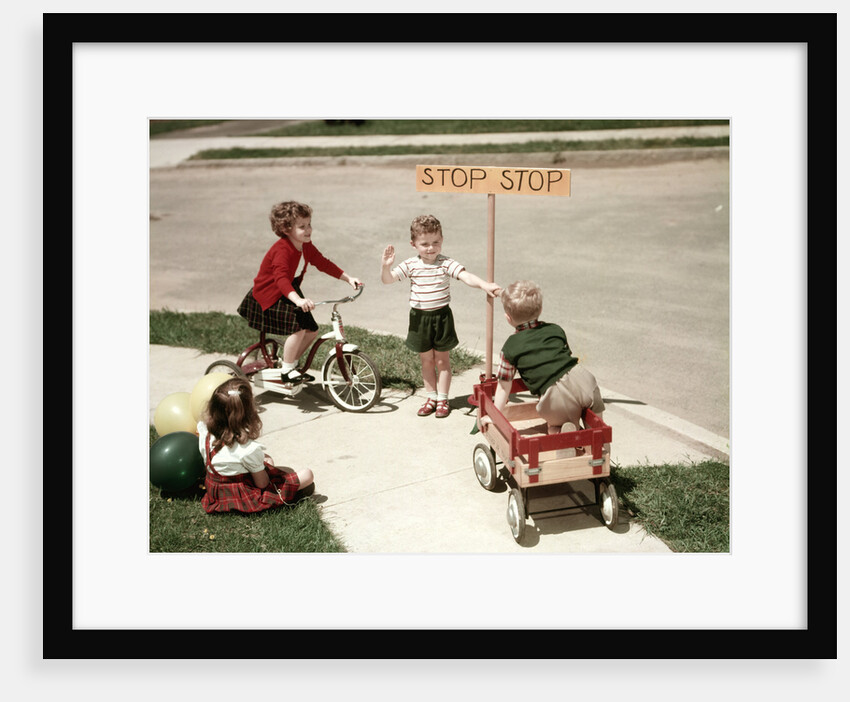 1950s Boys And Girls Outdoor With Tricycle And Wagon Playing Traffic With Police Stop Sign Americana by Anonymous