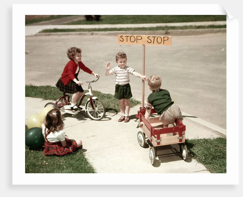 1950s Boys And Girls Outdoor With Tricycle And Wagon Playing Traffic With Police Stop Sign Americana by Anonymous
