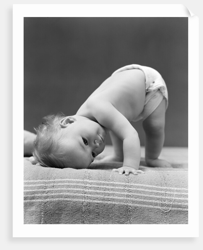 1940s Baby Bending Down With Head On Blanket by Anonymous