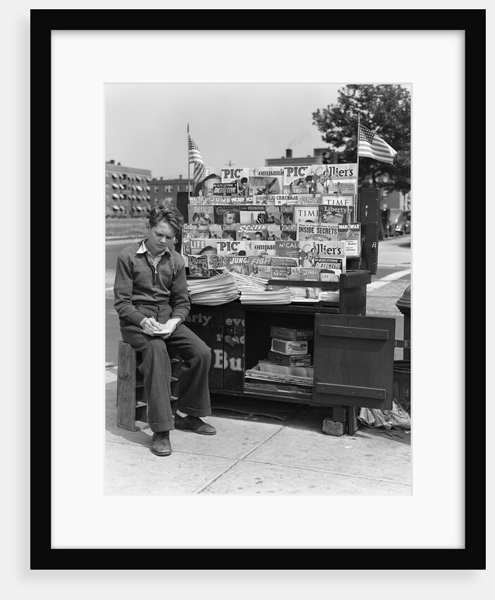 1940s Boy Sitting At Corner Newsstand Writing In Notepad by Anonymous