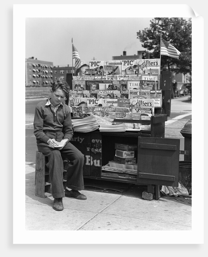 1940s Boy Sitting At Corner Newsstand Writing In Notepad by Anonymous