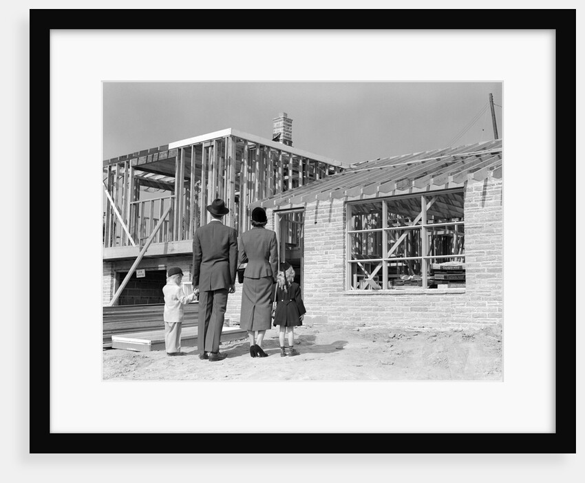 1950s Family Looking At New Home Under Construction by Anonymous
