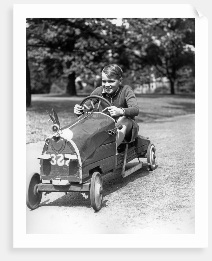 1930s Boy Driving Home Built Race Car Holding Steering Wheel by Anonymous