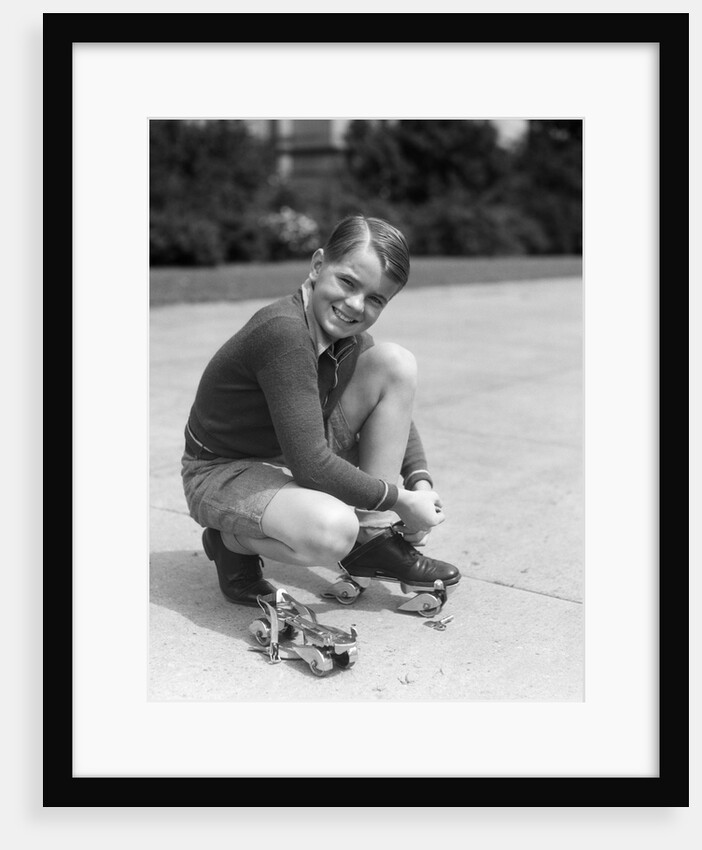 1930s Boy Fastening Metal Roller Skates by Anonymous