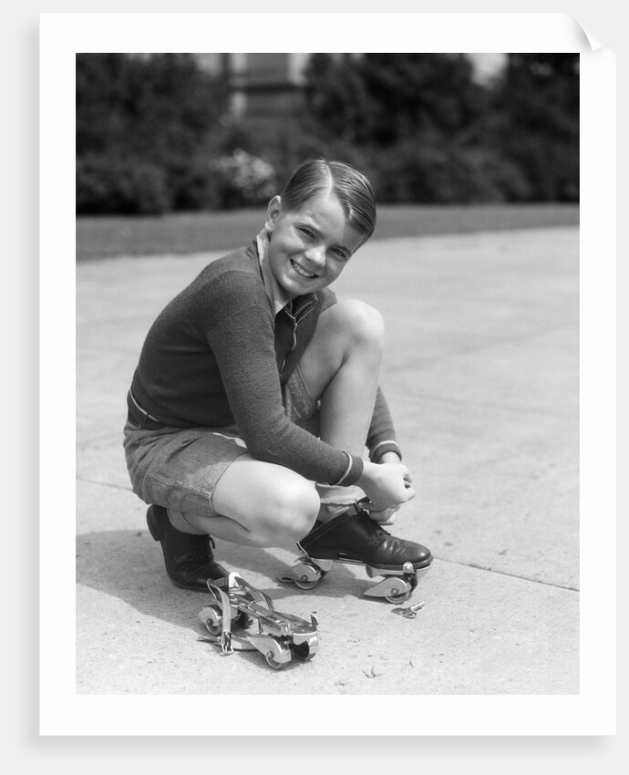 1930s Boy Fastening Metal Roller Skates by Anonymous