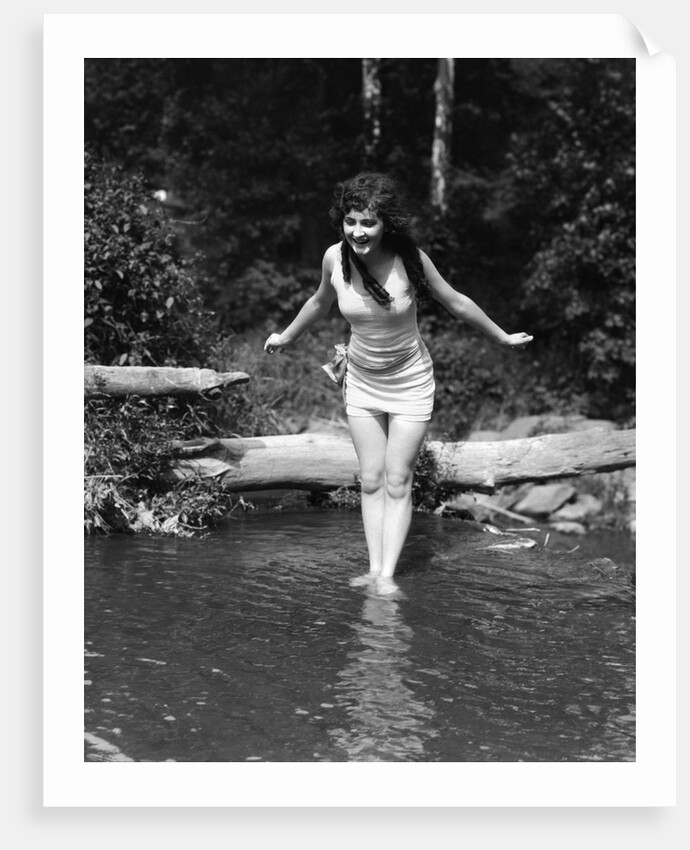 1920s Long-Haired Woman In Old Fashion Bathing Suit Standing In Pond With Feet In Water About To Dive Outdoor by Anonymous