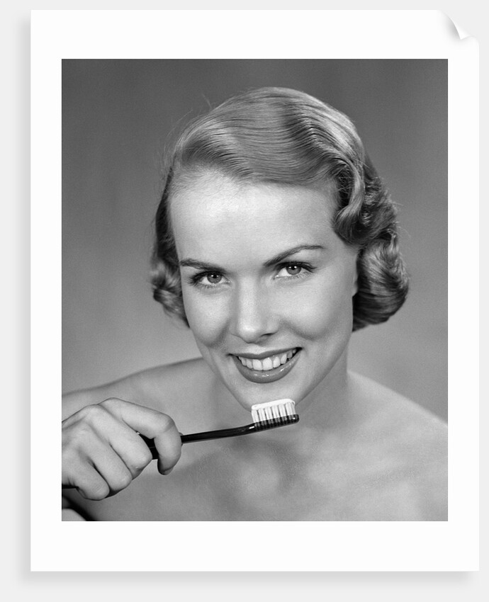1950s Woman Holding Tooth Brush by Anonymous