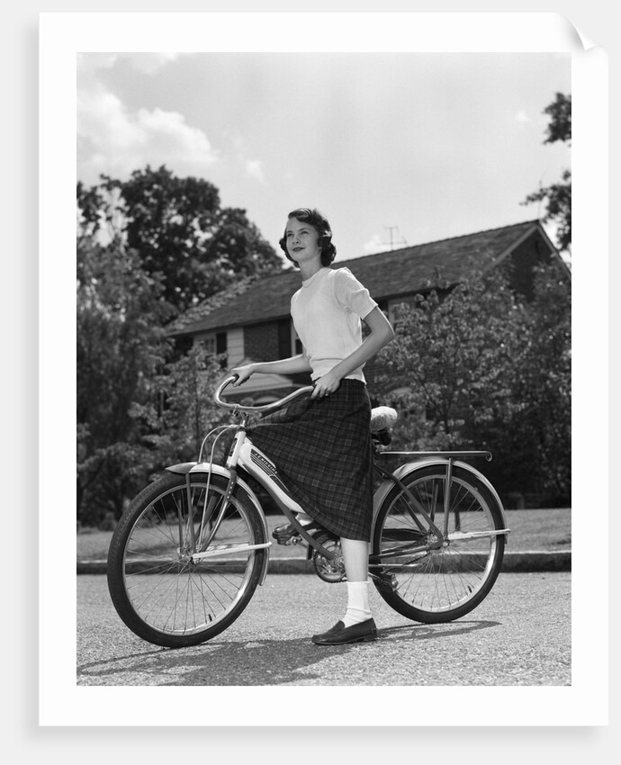 1950s Teen Girl Standing With Bike by Anonymous