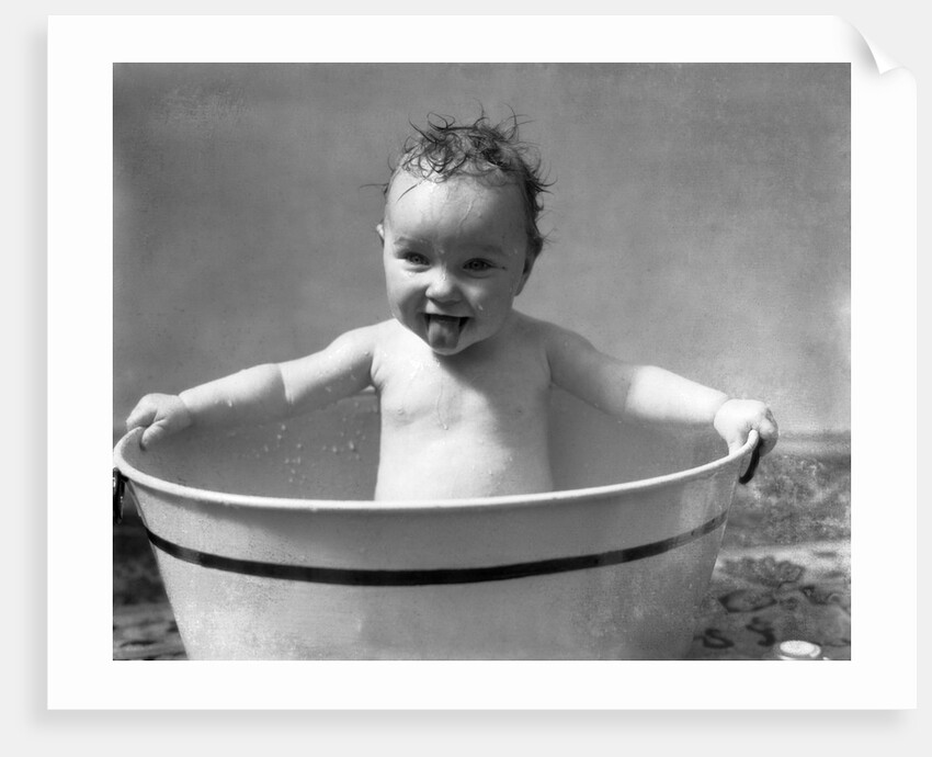 1930s Wet Baby In Washtub Sticking Out Tongue by Anonymous