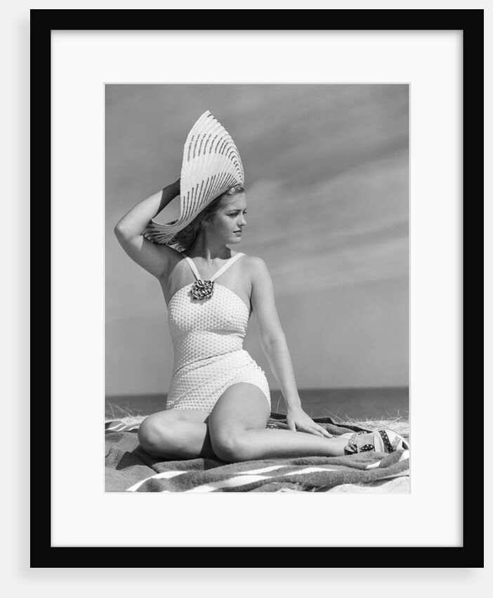 1940s Woman In White Bathing Suit On Beach Wearing Big Straw Hat by Anonymous