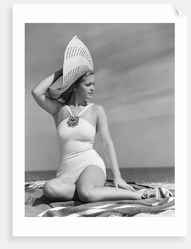 1940s Woman In White Bathing Suit On Beach Wearing Big Straw Hat by Anonymous