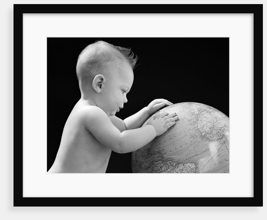 1940s Baby With Hands On Globe Looking At The Earth by Anonymous