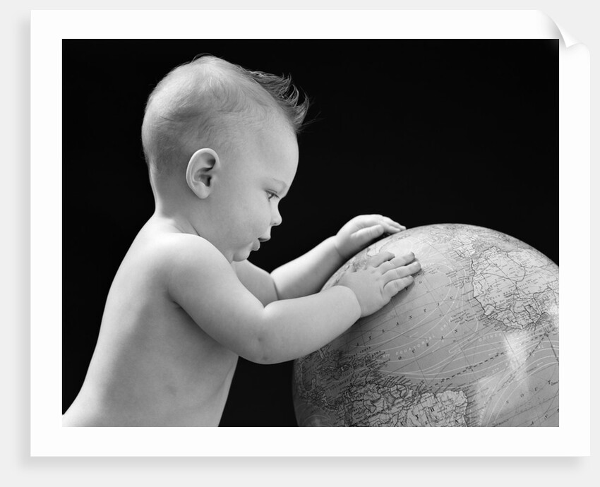 1940s Baby With Hands On Globe Looking At The Earth by Anonymous