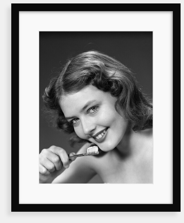 1940s 1950s Woman Holding Tooth Brush by Anonymous