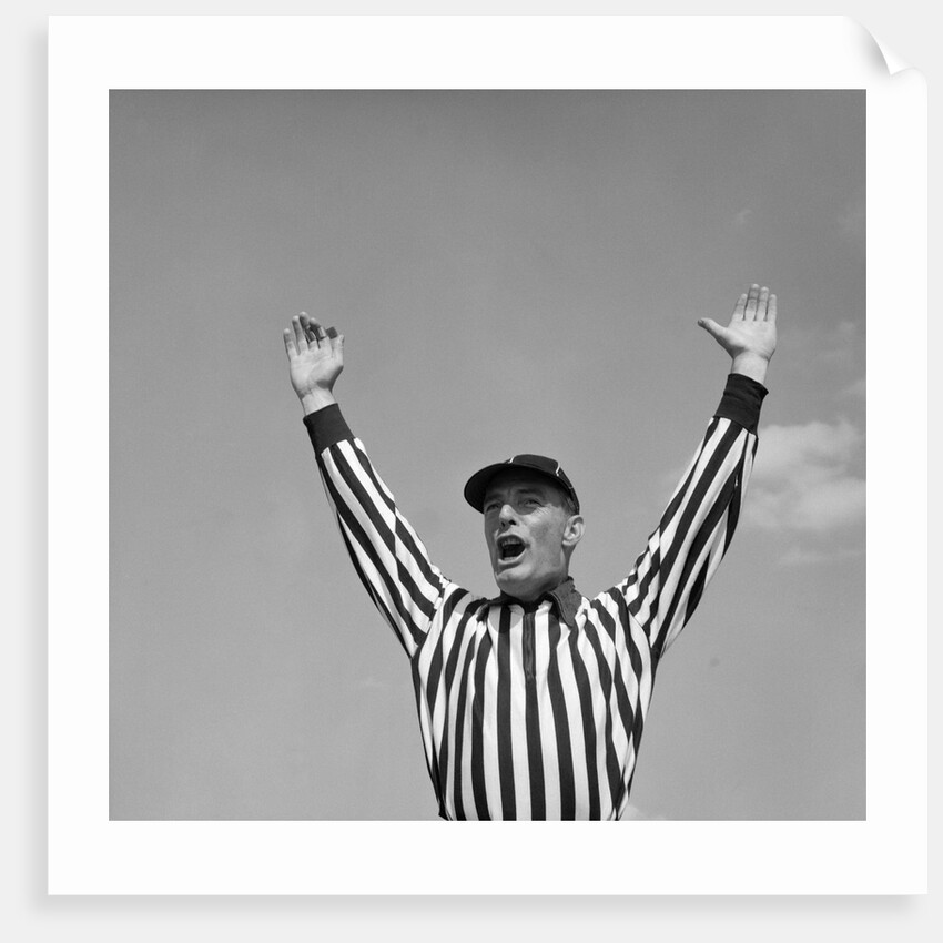 1950s Football Referee Making Touchdown Signal by Anonymous