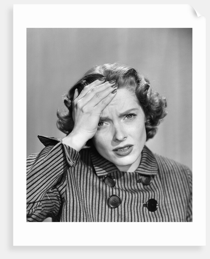 1950s Stressed Woman In Striped Dress Hold Forehead With Hand by Anonymous