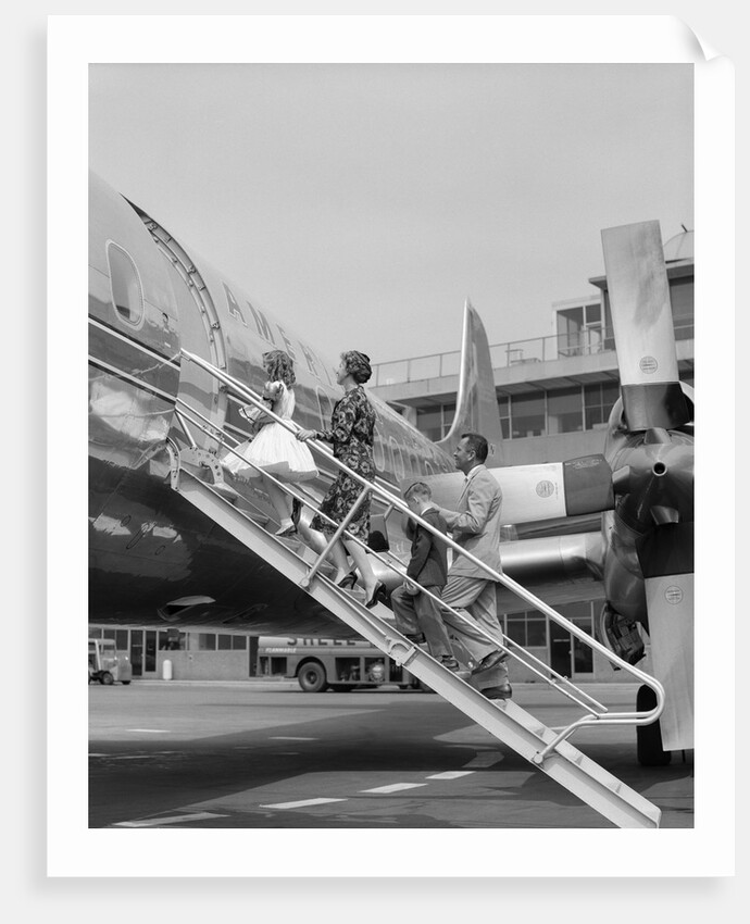 1950s Family Boarding Propeller Airliner By Climbing Gangway Stairs At Airport by Anonymous